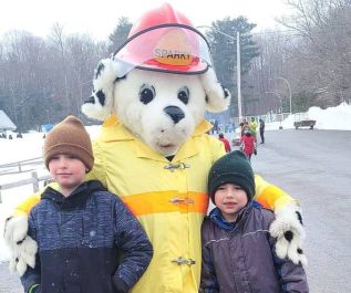 Sparky the fire dog pals around with the kids at the North Frontenac Winterfest.